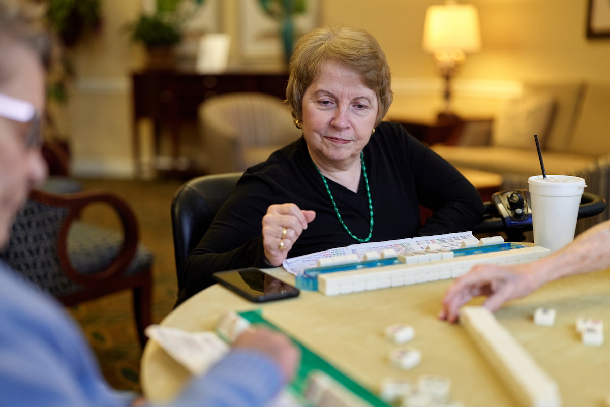 A resident of Masonic Homes Kentucky enjoys playing a game